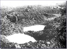 Canadians at Vimy Ridge using crater as machine gun post.