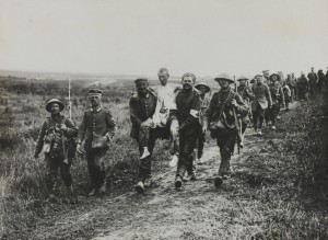 British Soldiers carry German wounded. 